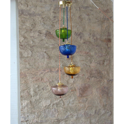 Hanging farandole of old spinning tops oil tank colored blown glass. 