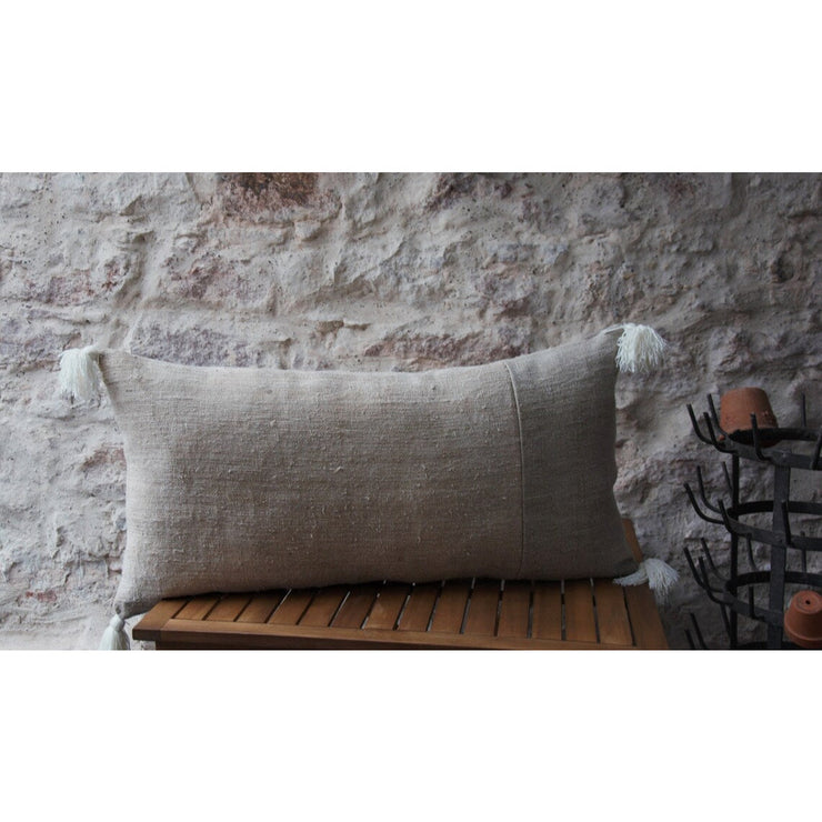 Long patchwork cushion in antique bis and off-white hemp.