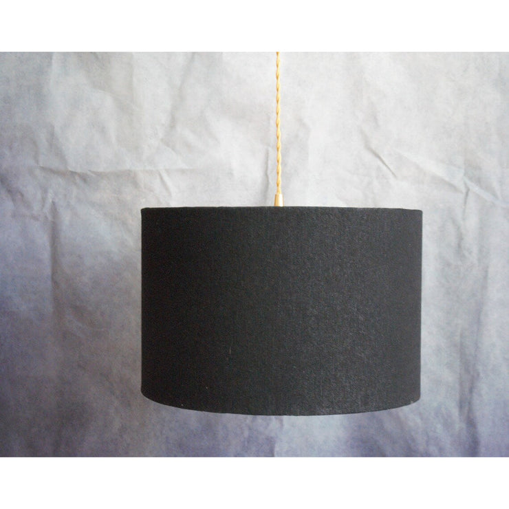 Double-sided lampshade suspension: black denim side and organic printed cotton.