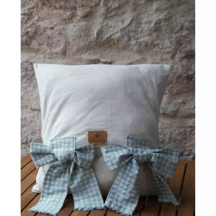 Blue and white gingham decorative cushion, linen on the back of the cushion.