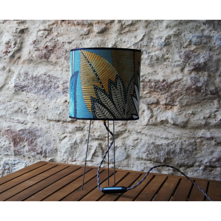 Small table lamp with Casamance wallpaper shade on tripod and gold polyphane.