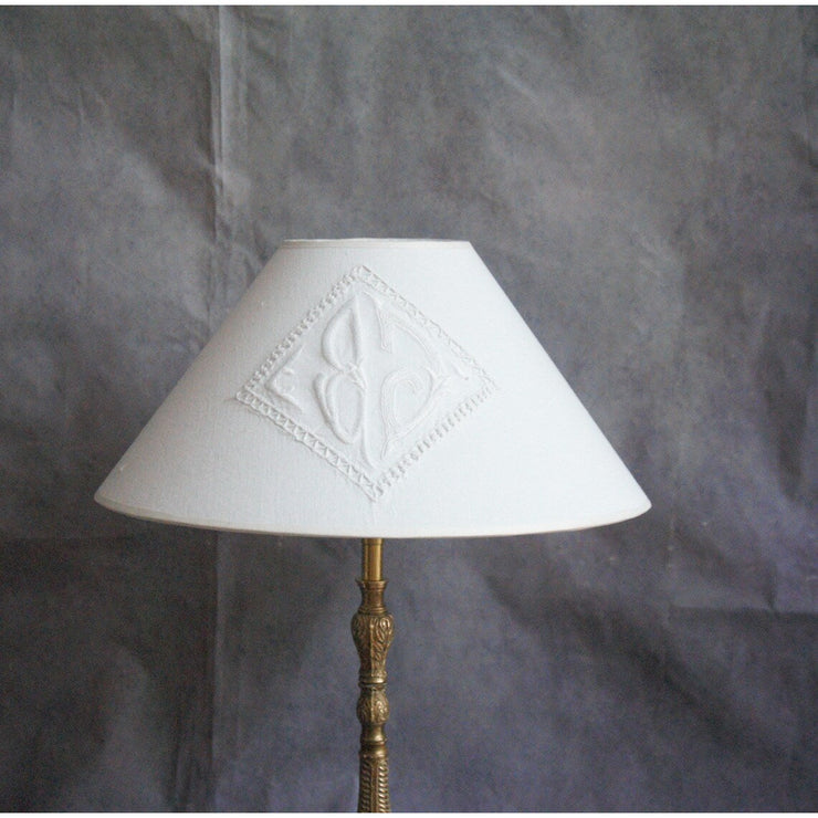 Bronze table lamp, old candle stick with monogrammed cotton lampshade.
