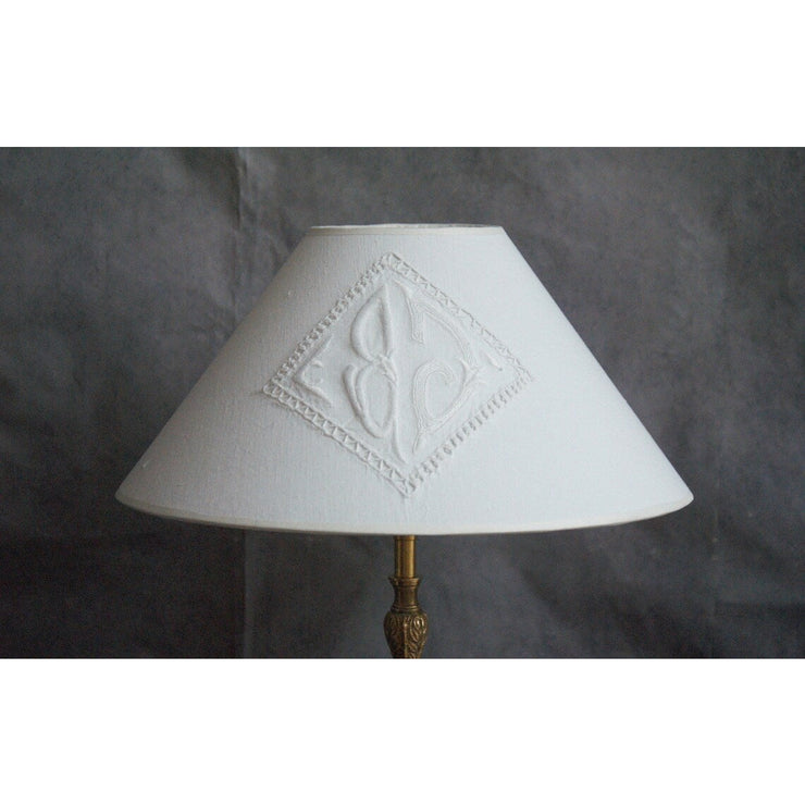 Bronze table lamp, old candle stick with monogrammed cotton lampshade.