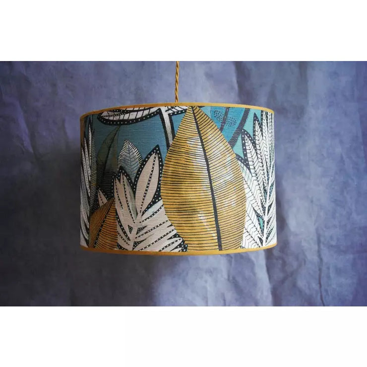 Casamance non-woven paper lampshade suspension on golden polyphane.