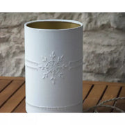Small table lamp with antique white cotton shade embroidered with flowers and ladder openings on gold polyphane.