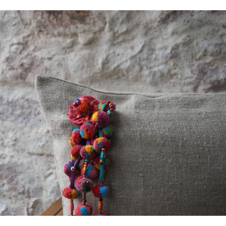 Decorative cushion in thick natural linen and Colombian grigri.