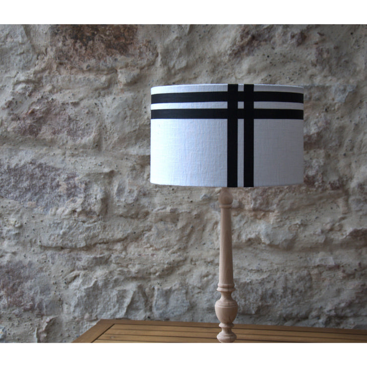 Round linen lampshade, black border.